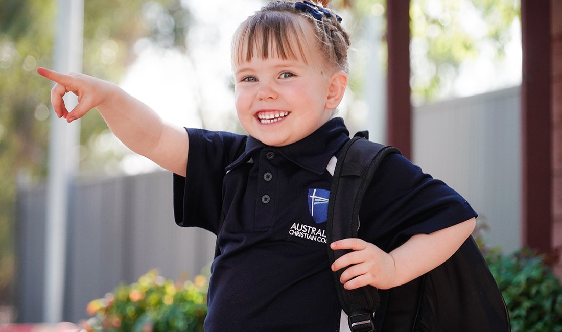 smiling pointing-girlat early learning center